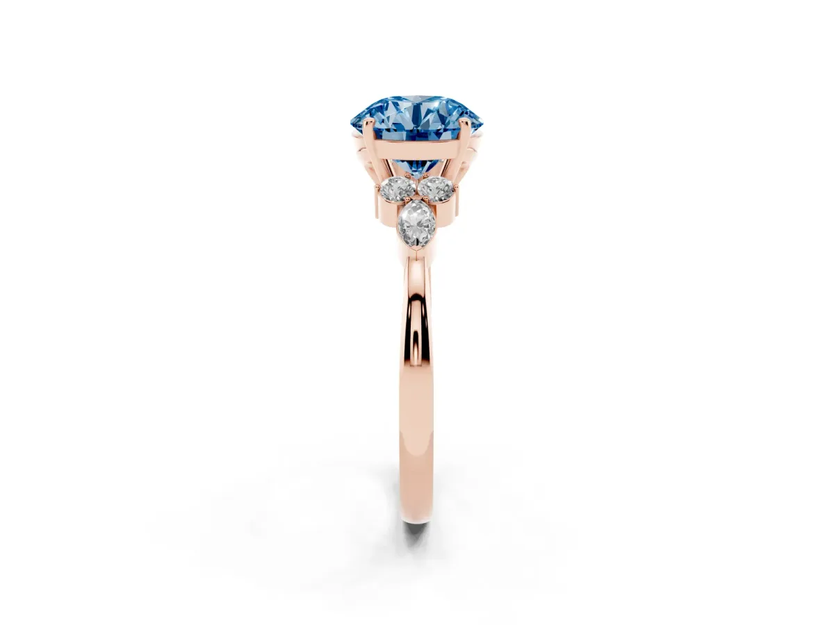 Fancy Blue Round Cut Brilliant Diamond Solitaire Ring with Pear Side Stones and Four-Prong Setting Rose gold