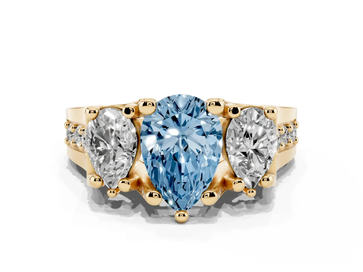 Fancy Blue Pear Cut Diamond Three-Stone Ring with Channel Set Band and Four-Prong Setting Yellow gold