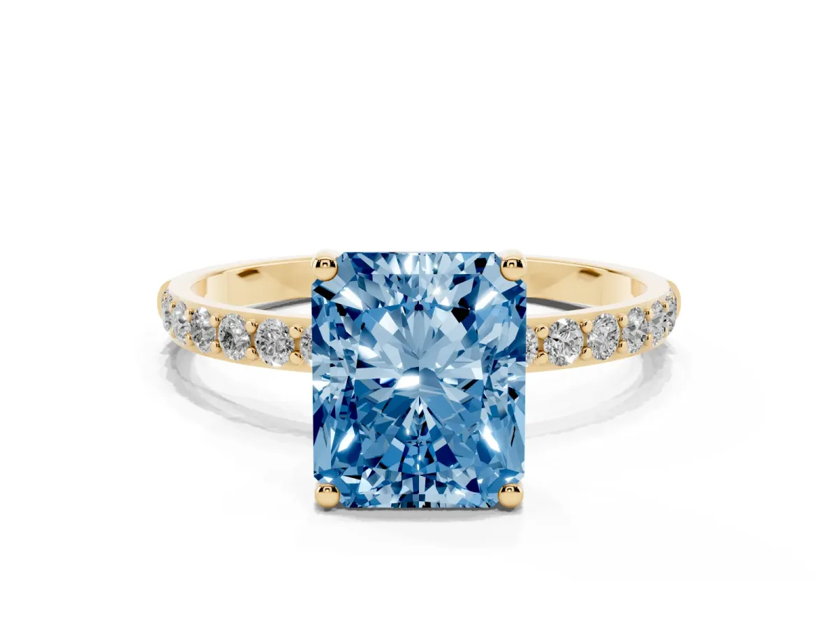 Fancy Blue Radiant Cut Diamond Solitaire Ring with Round Pavé Shoulders and Prong Setting Yellow gold