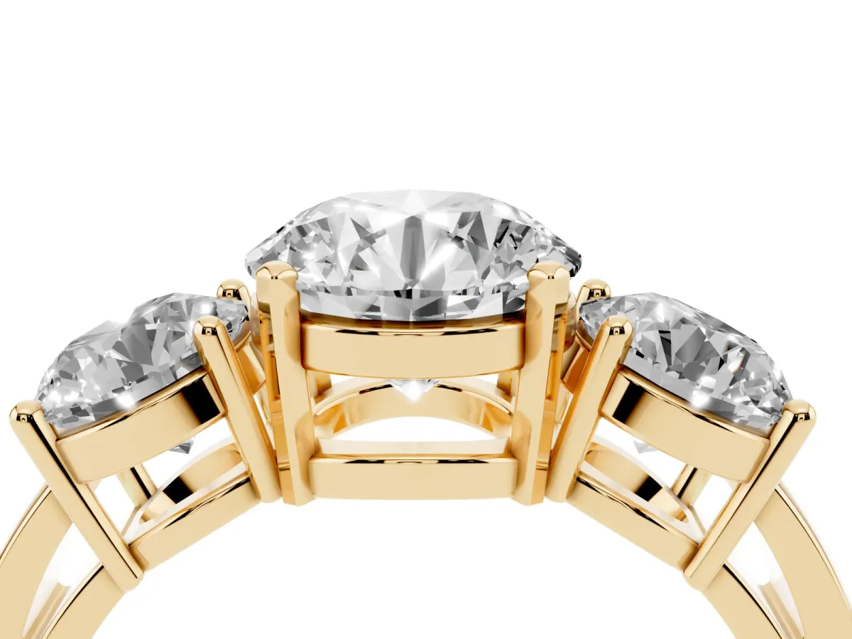 Three-Stone Round Cut Diamond Ring with Round Side Stones, Classic Band, and Four-Prong Setting Yellow gold