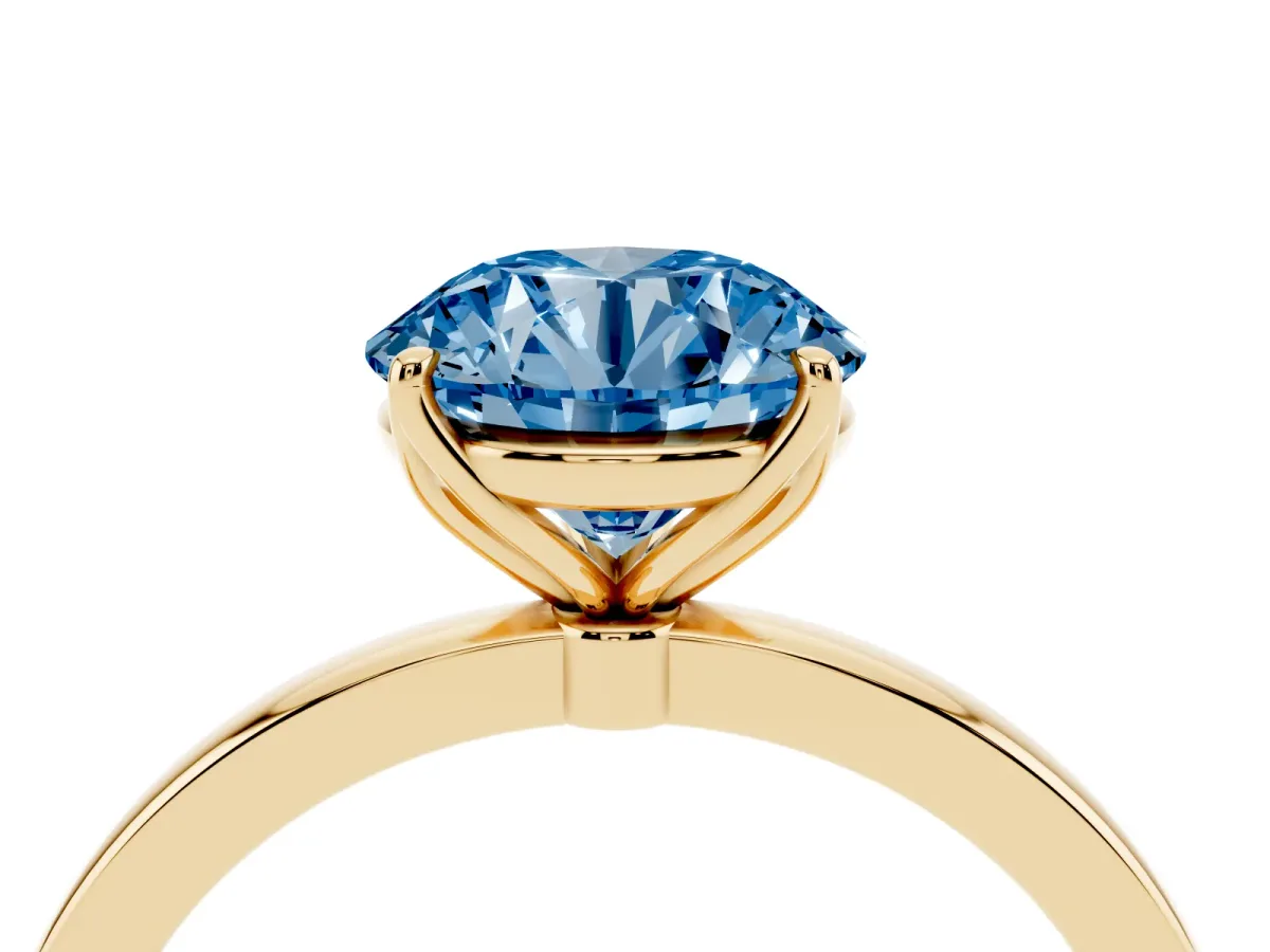 Fancy Blue Round Cut Diamond Solitaire Ring with Thin Band and Prong Setting Yellow gold