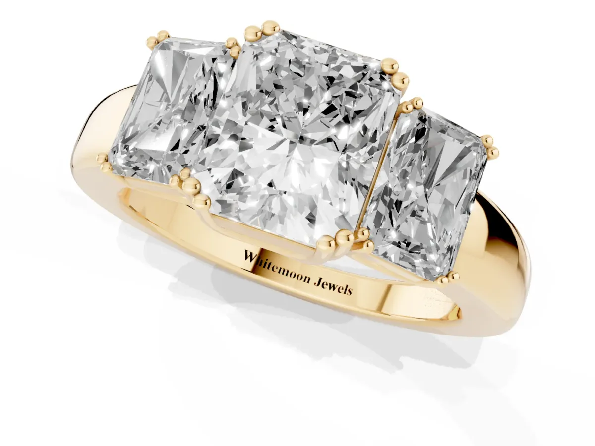 Three-Stone Radiant Cut Cut Diamond Ring with Channel Set Band and Four-Prong Setting Yellow gold