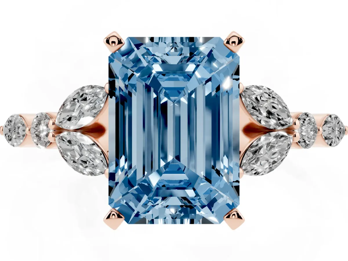 Fancy Blue Emerald Cut Diamond Solitaire Ring with Side Stones and Four-Prong Setting Rose gold