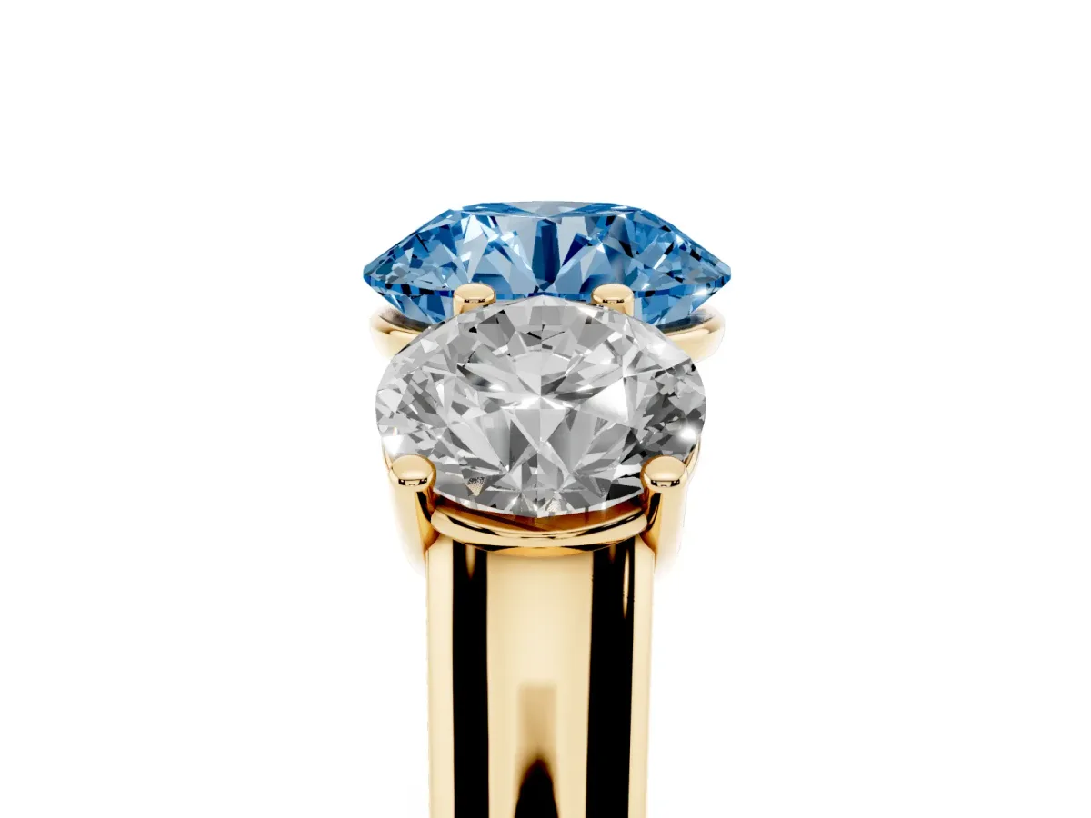 Fancy Blue Round Cut Three-Stone Diamond Ring with Prong Setting on a Classic Band Yellow gold