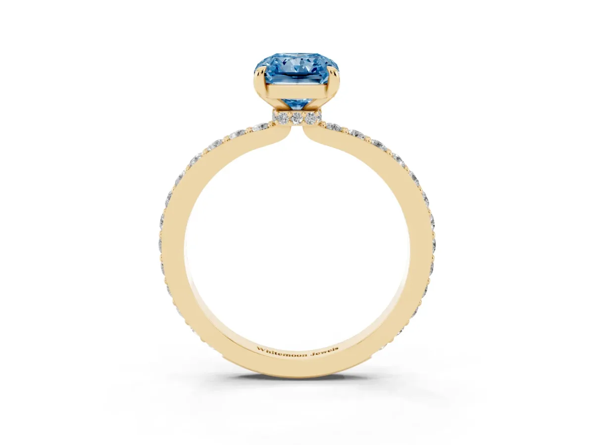 Fancy Blue Radiant Cut Diamond Pavé Engagement Ring with Round Accents and Prong Setting Yellow gold