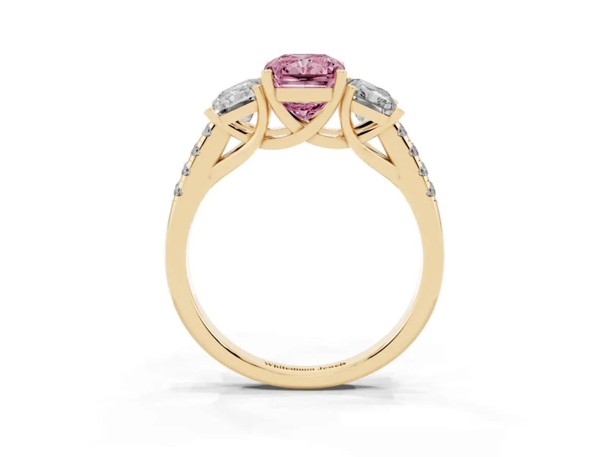 Fancy Pink Three-Stone Radiant Cut Diamond Ring with Round Pavé Band and Prong Setting Yellow gold