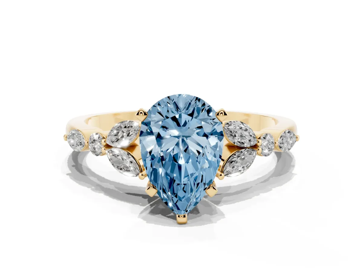 Fancy Blue Pear Cut Diamond Solitaire Ring with Side Stones and Four-Prong Setting Yellow gold