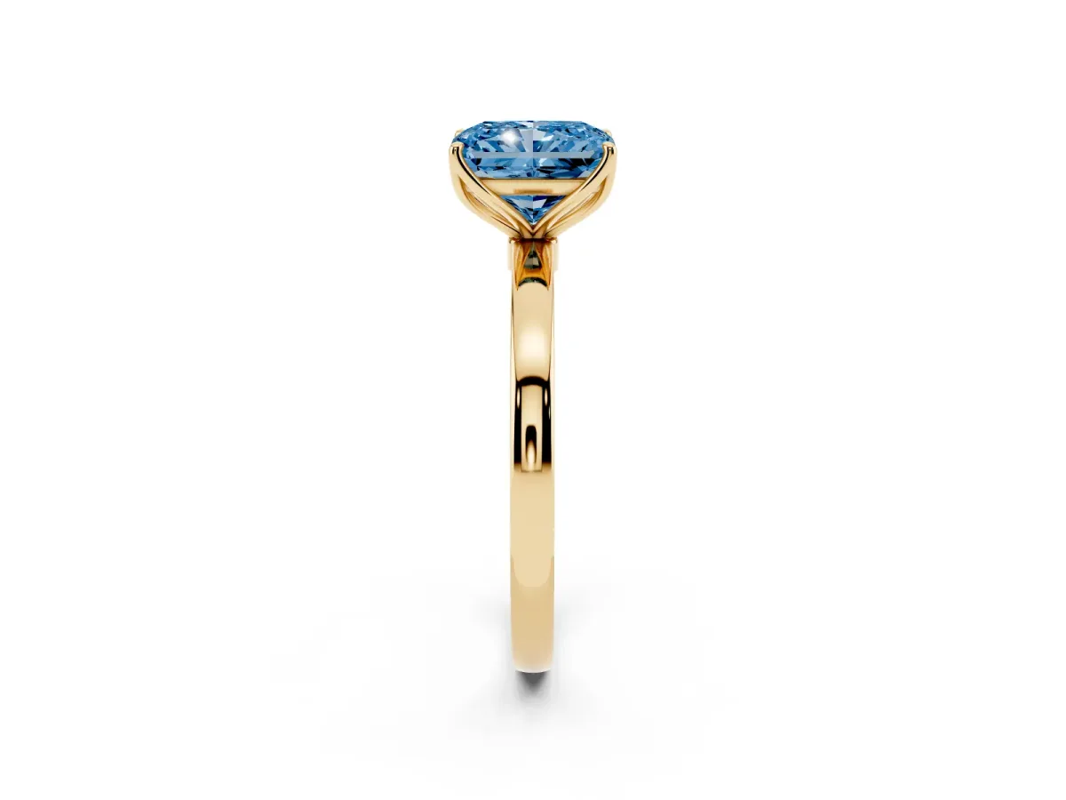 Fancy Blue Radiant Cut Diamond Solitaire Ring with Thin Band and Prong Setting Yellow gold