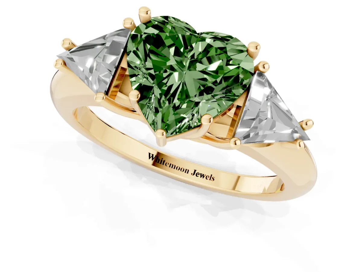 Fancy Green Three-Stone Heart Cut Diamond Engagement Ring with Trillion Side Stones and Prong Setting Yellow gold