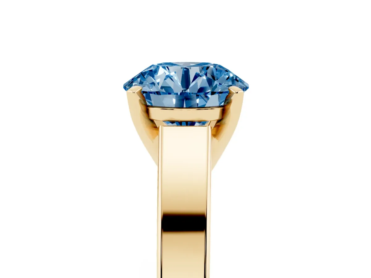 Fancy Blue Round Cut Solitaire Engagement Ring with Four-Prong Setting and Tapered Band Yellow gold
