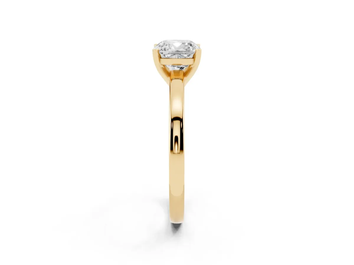 Cushion Cut Solitaire Diamond Engagement Ring with Four-Prong Setting on a Classic Band Yellow gold