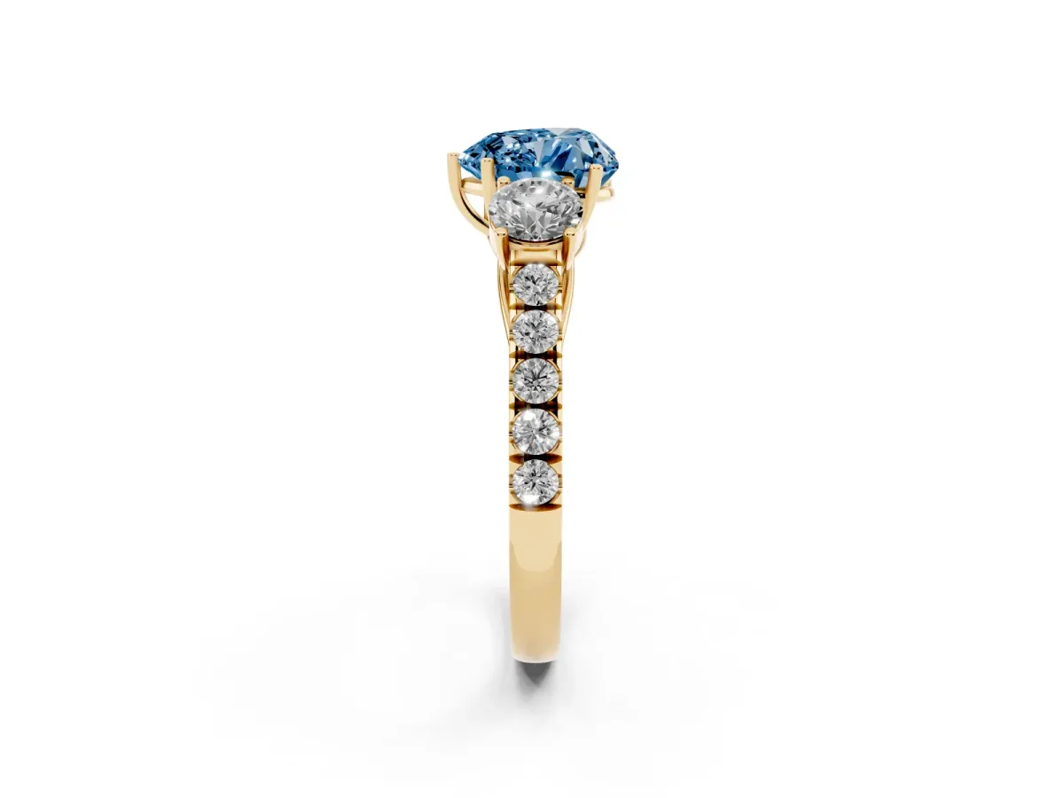 Fancy Blue Heart Cut Cut Diamond Three-Stone Ring with Round Side Stones and Pavé Band Yellow gold