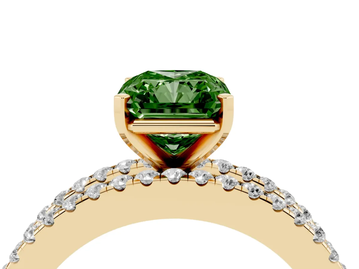 Fancy Green Radiant Cut Diamond Solitaire Ring with Pavé and Channel Set Band Yellow gold