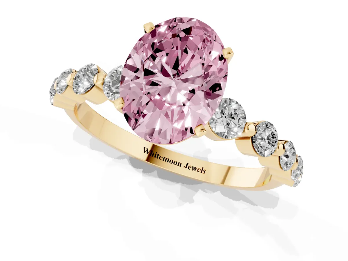Fancy Pink Oval Cut Solitaire Diamond Ring with Pave Band and Four-Prong Setting Yellow gold