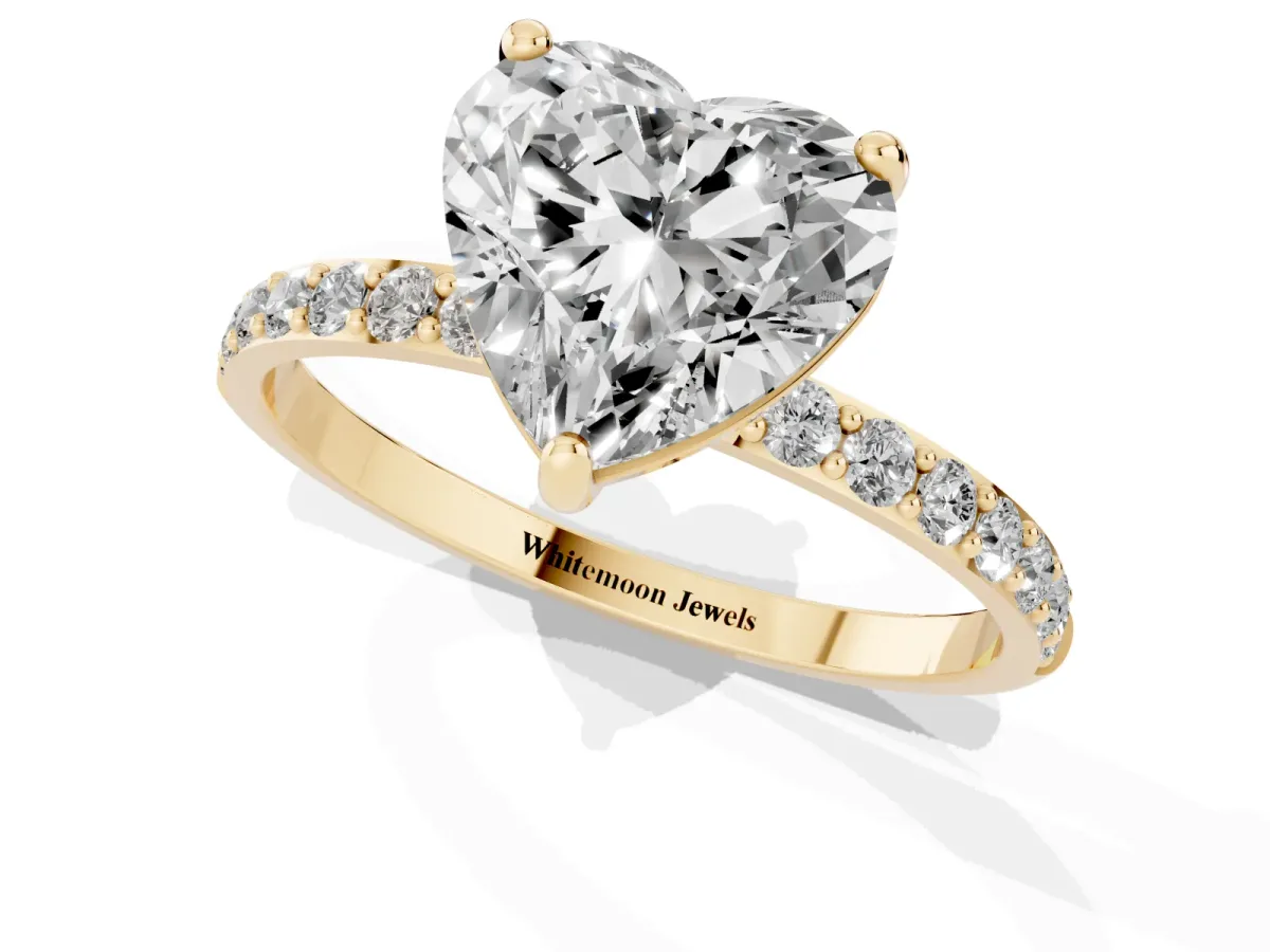Heart Cut Diamond Solitaire Ring with Round Pavé Band and Prong Setting Yellow gold
