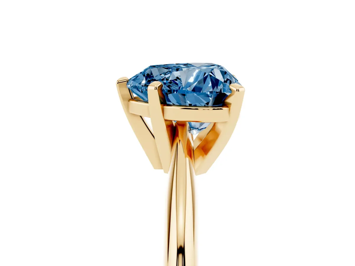 Fancy Blue Heart Cut Cut Solitaire Ring with Four-Prong Setting on a Classic Band Yellow gold