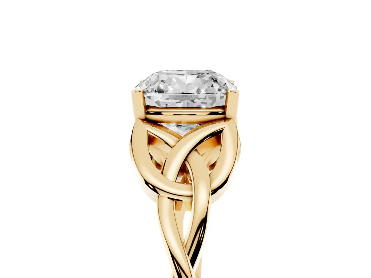 Cushion Cut Diamond Solitaire Engagement Ring with Celtic Knot Band and Four-Prong Setting Yellow gold