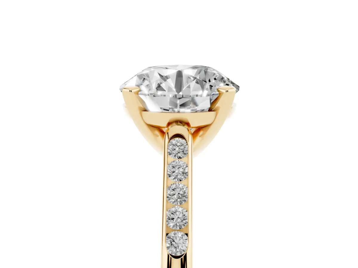 Round Cut Diamond Solitaire Ring with Channel Set Round Band and Prong Setting Yellow gold