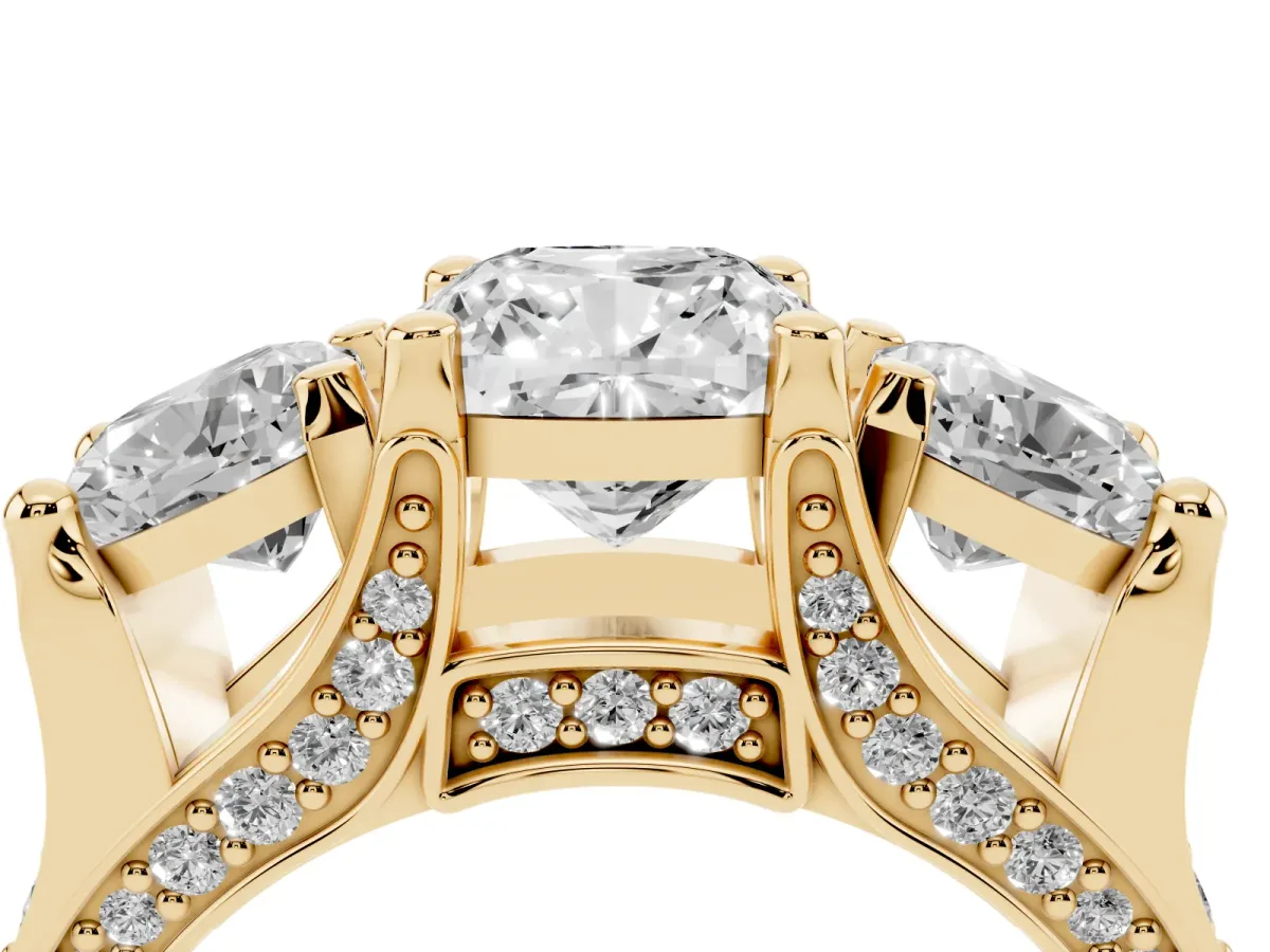 Cushion Cut Diamond Three-Stone Ring with Channel Set Band and Four-Prong Setting Yellow gold