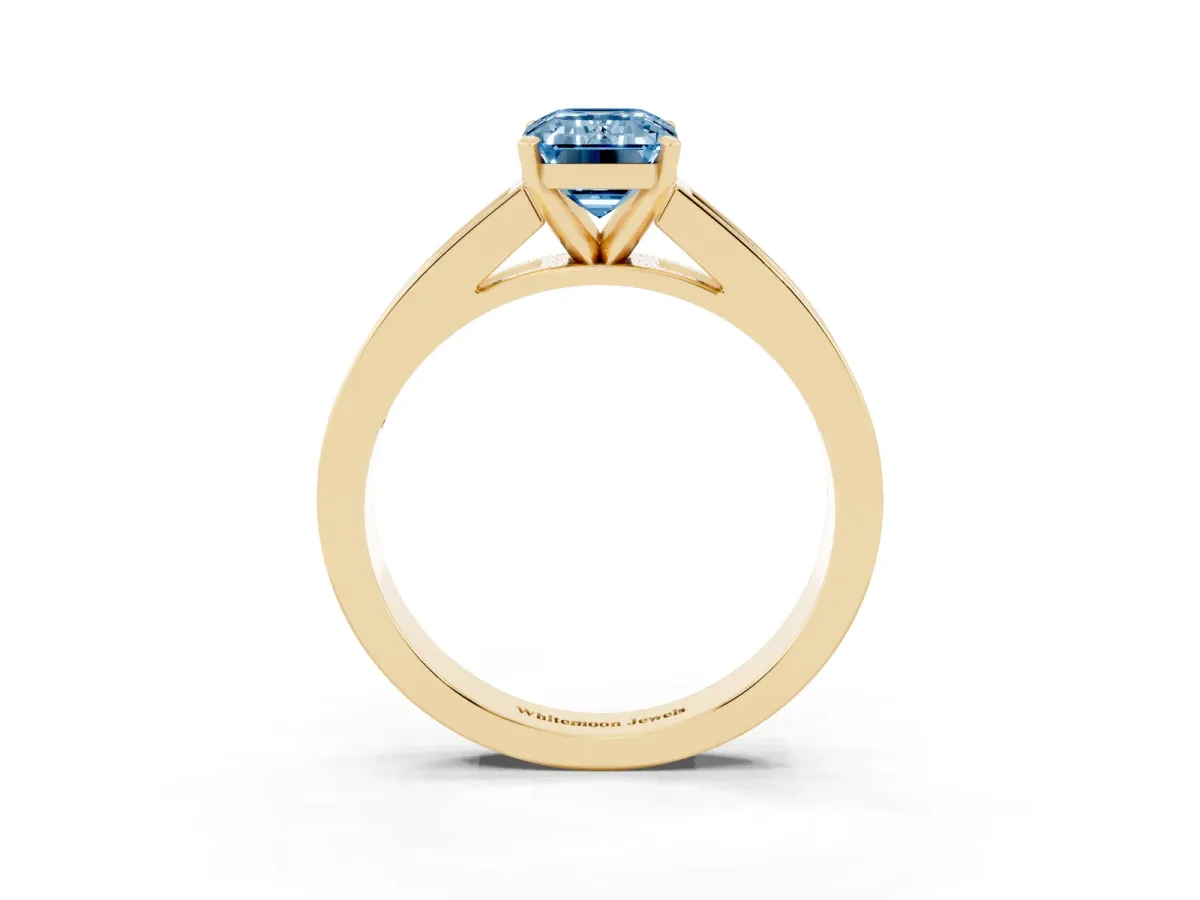 Fancy Blue Emerald Cut Solitaire Diamond Ring with Channel-Set Band and Four-Prong Setting Yellow gold