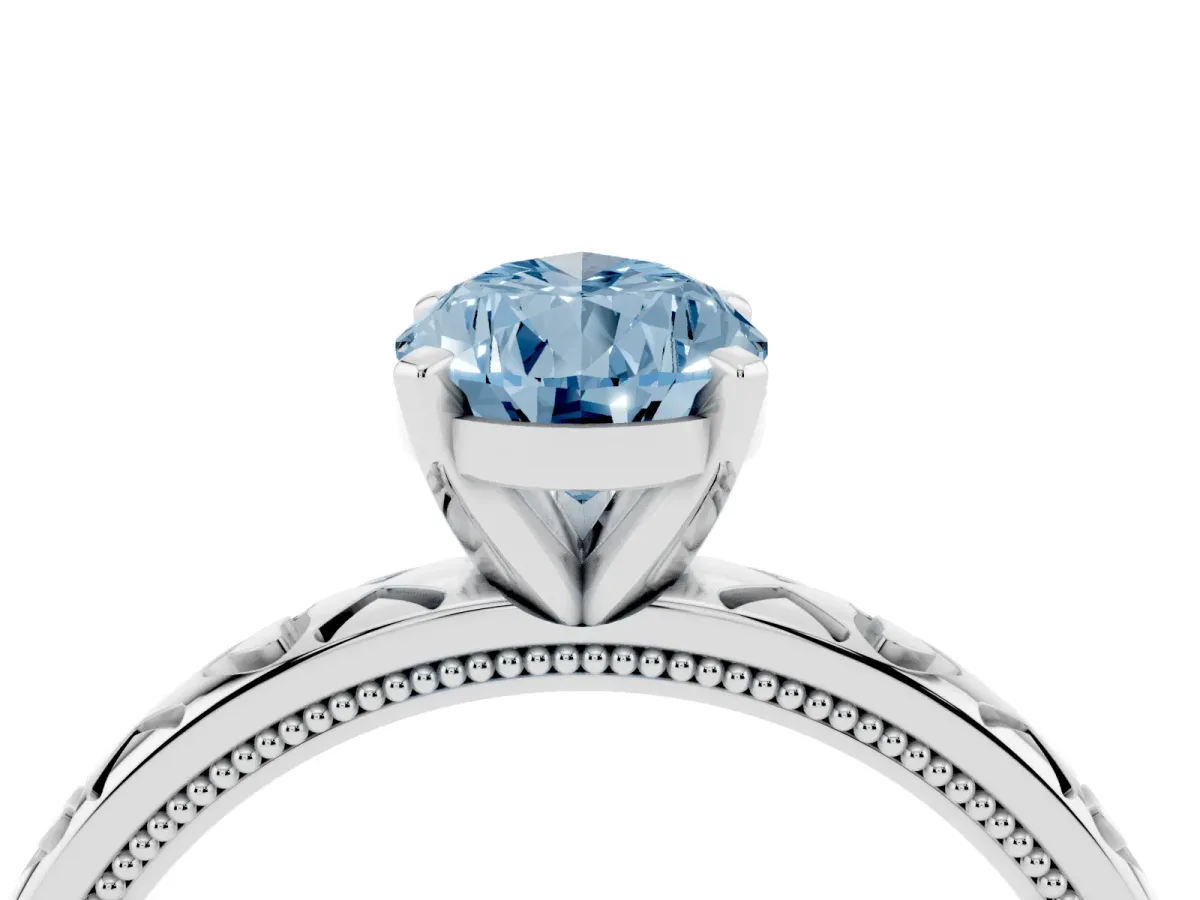 Fancy Blue Pear Cut Solitaire Diamond Engagement Ring with XO Engraved Band and Four-Prong Setting White gold