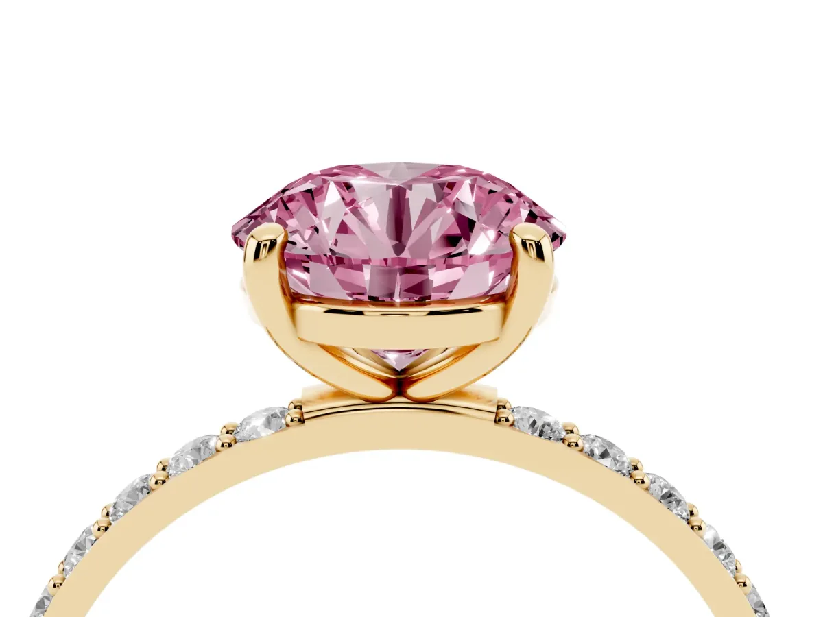 Fancy Pink Round Cut Diamond Solitaire Ring with Round Pavé Band and Prong Setting Yellow gold