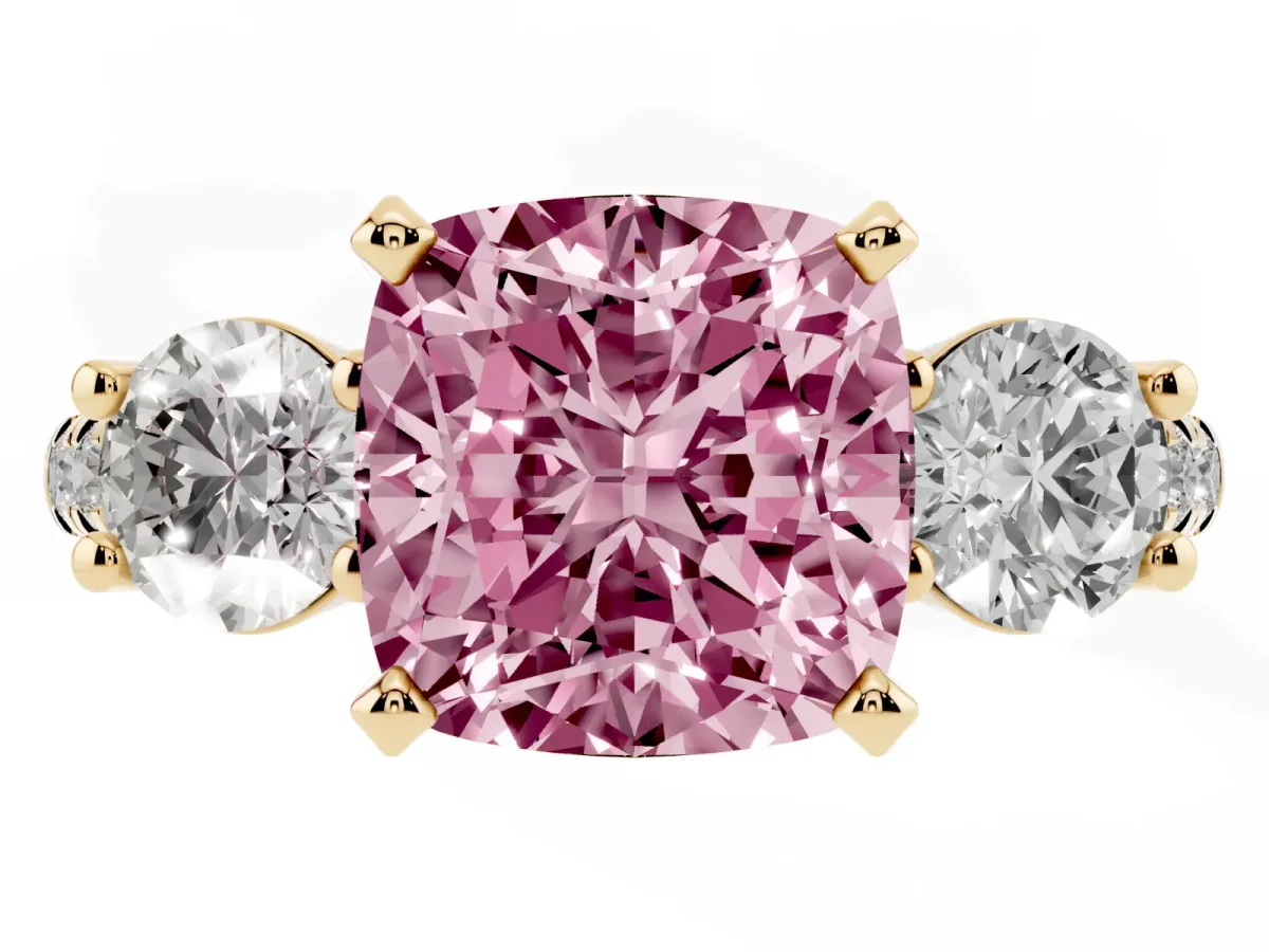 Fancy Pink Three-Stone Cushion Cut Diamond Pavé Band with Four-Prong Setting Yellow gold