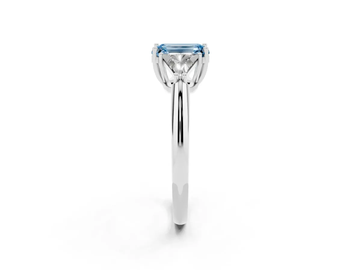 Fancy Blue Three-Stone Emerald Cut Diamond Engagement Ring with Trillion Side Stones and Prong Setting Silver