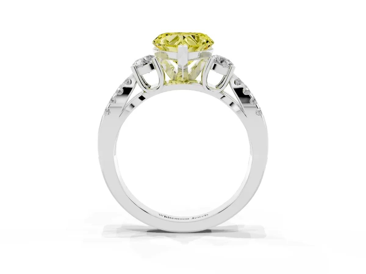 Fancy Yellow Heart Cut Diamond Three-Stone Ring with Pavé Split Shank and Four-Prong Setting Platinum