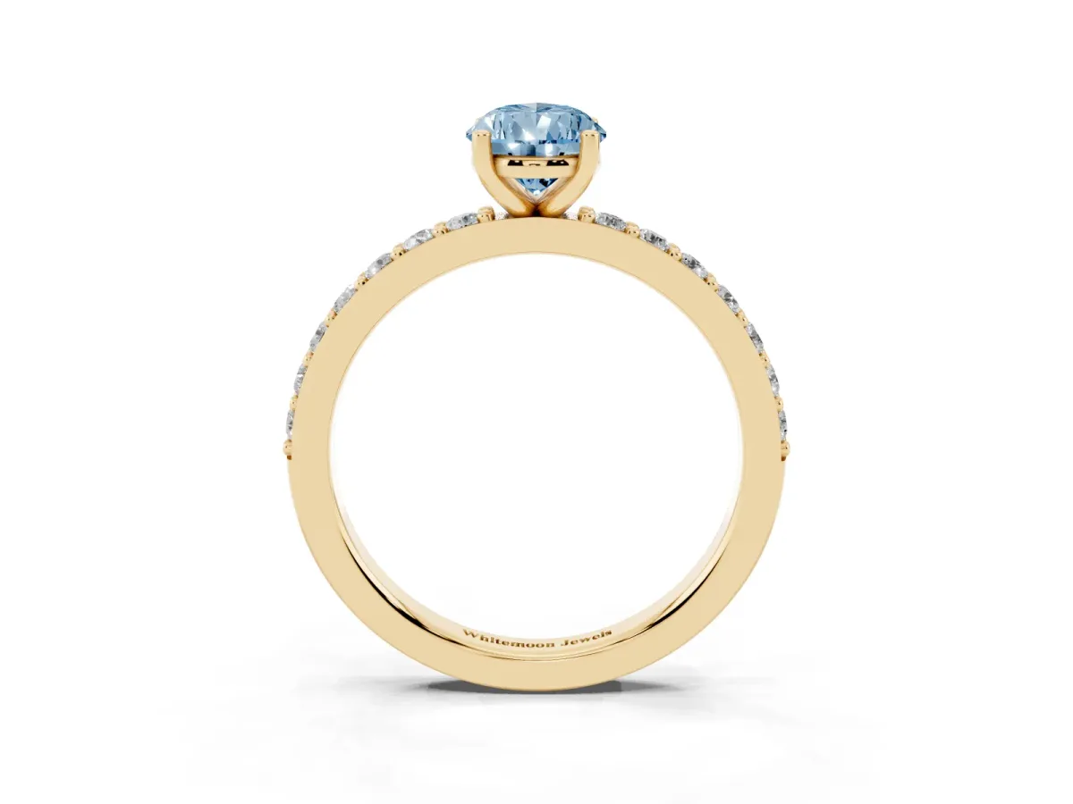 Fancy Blue Pear Cut Cut Diamond Solitaire with Pave Band and Four-Prong Setting Yellow gold