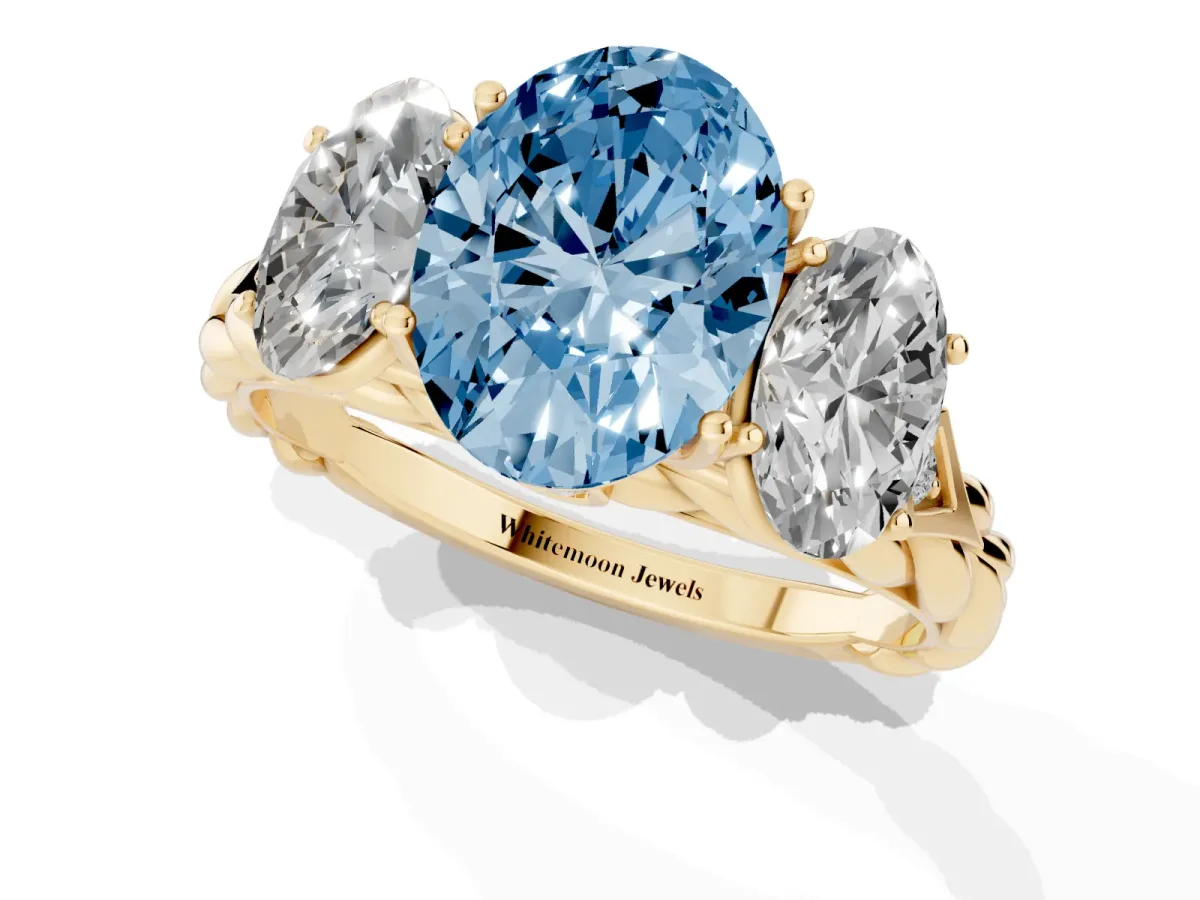 Fancy Blue Three-Stone Oval Cut Diamond Braided Band Ring with Four-Prong Setting Yellow gold