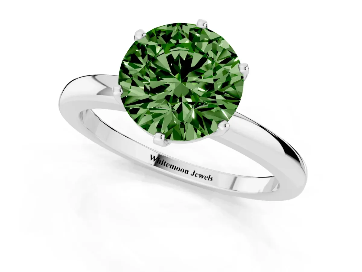 Fancy Green Round Cut Solitaire Diamond Ring with Six-Prong Setting on a Classic Band Silver