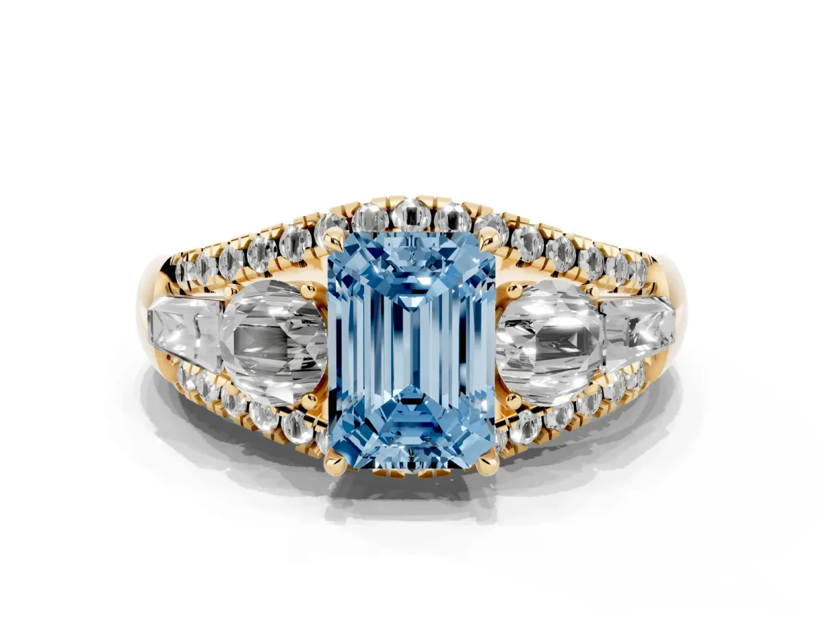 Fancy Blue Three-Stone Emerald Cut Diamond Engagement Ring with Pave Band and Prong Setting Yellow gold