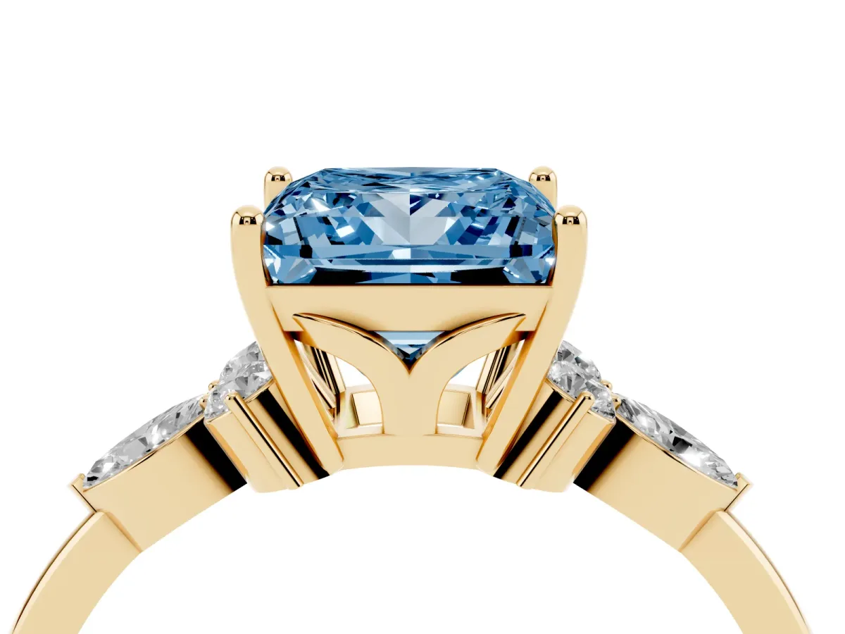 Fancy Blue Princess Cut Brilliant Diamond Solitaire Ring with Pear Side Stones and Four-Prong Setting Yellow gold