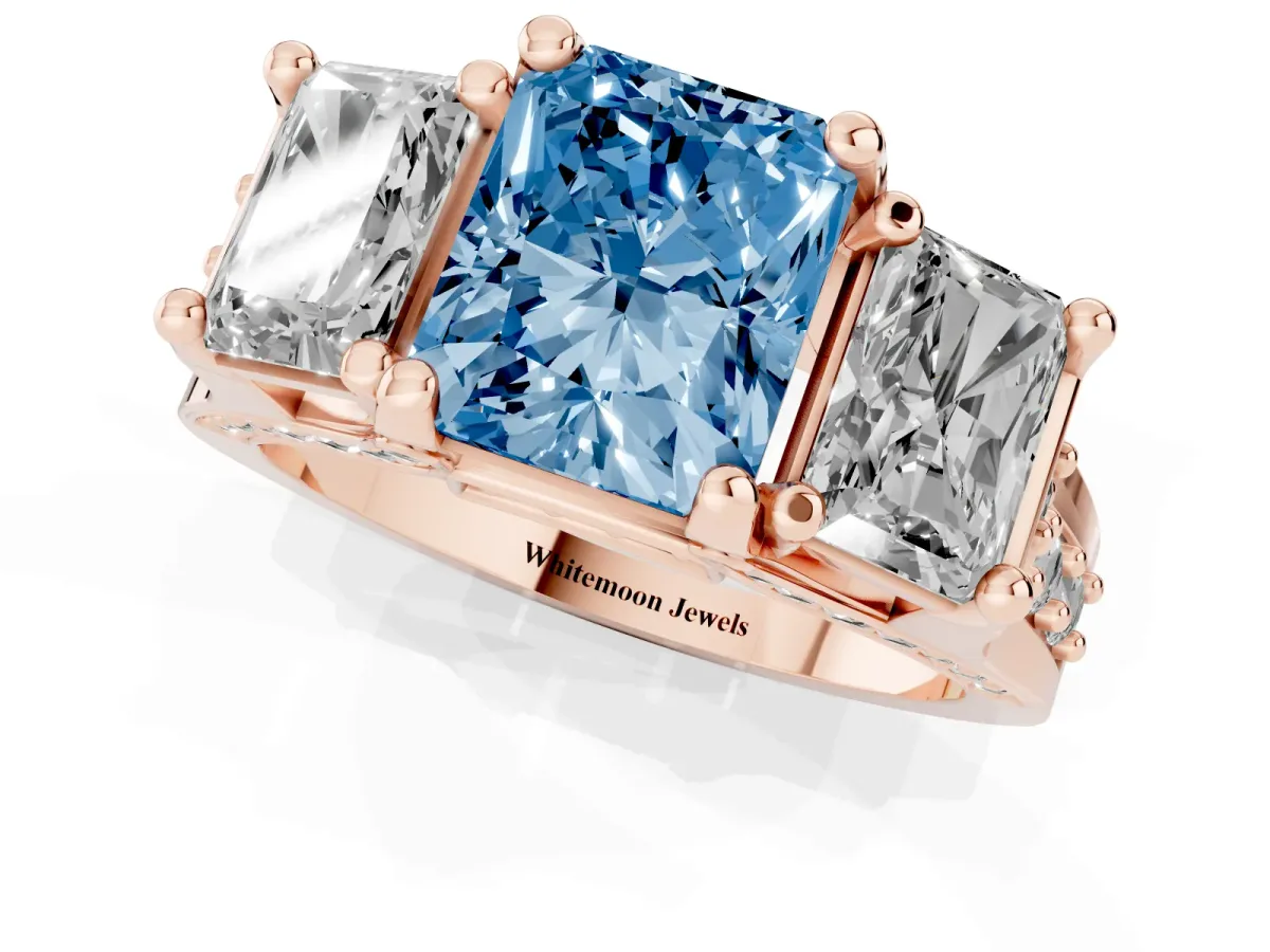 Fancy Blue Radiant Cut Diamond Three-Stone Ring with Channel Set Band and Four-Prong Setting Rose gold