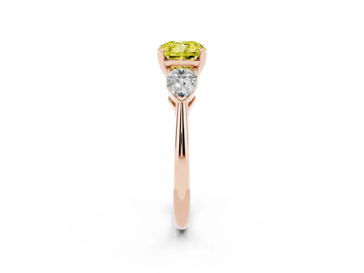 Fancy Yellow Three-Stone Cushion Cut Diamond Ring with Pear Side Stones and Four-Prong Setting Rose gold