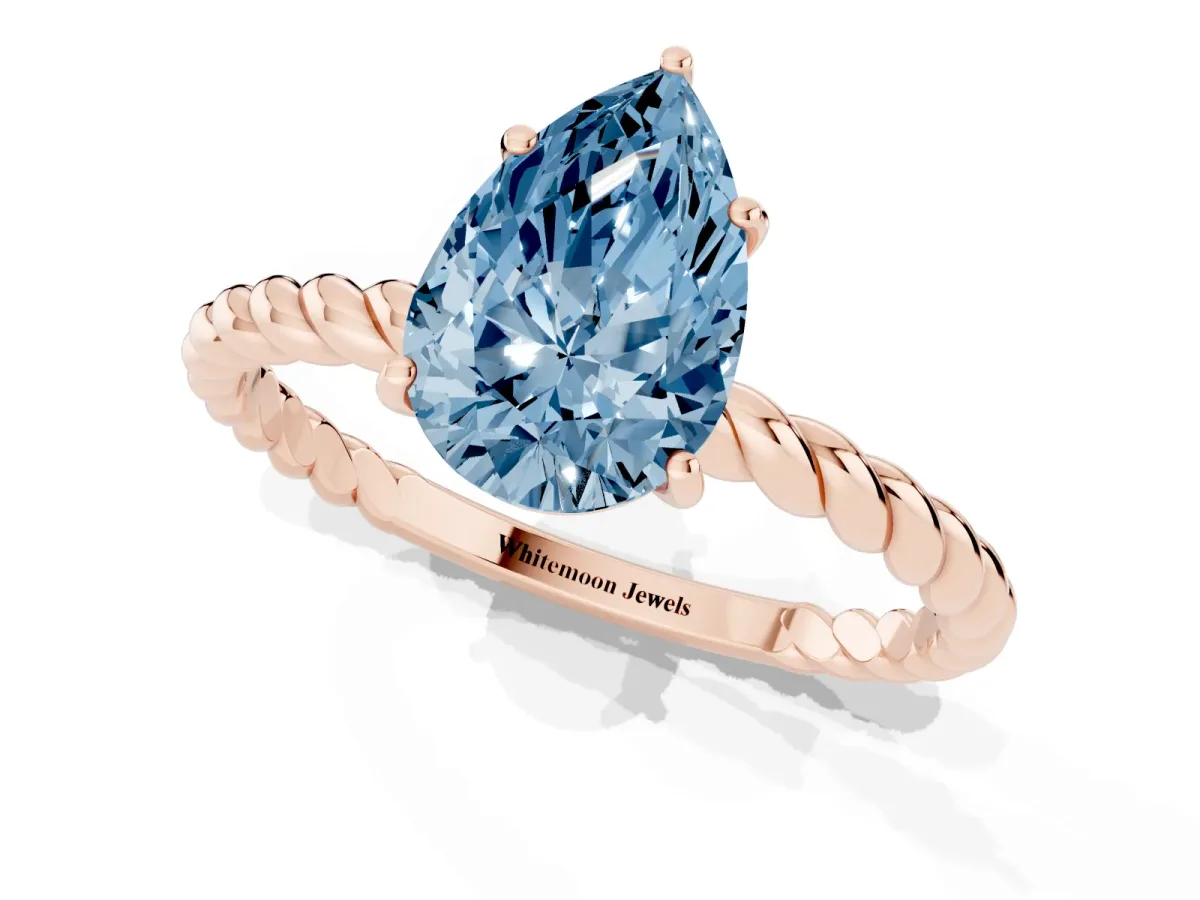 Fancy Blue Pear Cut Solitaire Twist Band Ring with Four-Prong Setting Rose gold