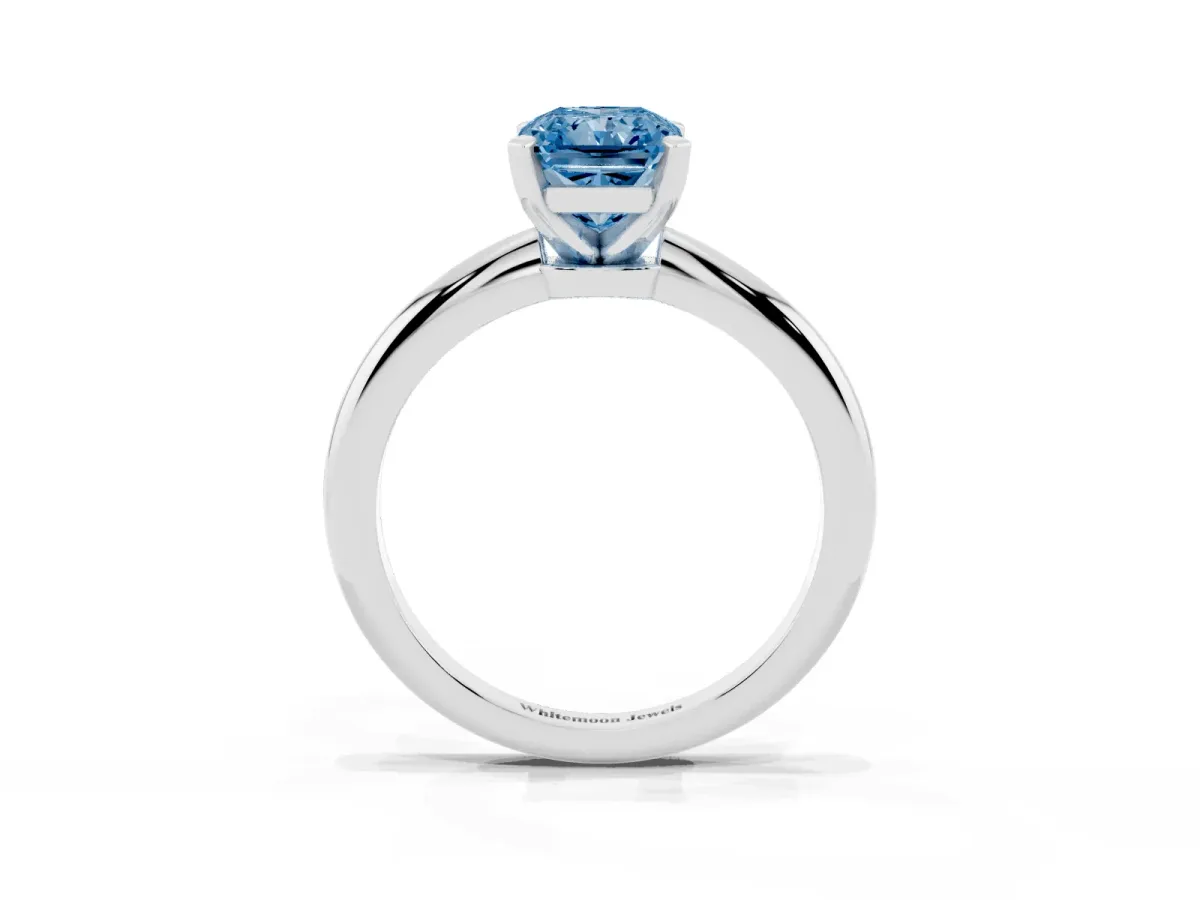 Fancy Blue Radiant Cut Diamond Solitaire Ring with Prong Setting and Classic Band Platinum