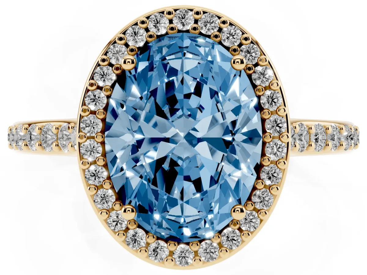 Fancy Blue Oval Cut Diamond Halo Engagement Ring with Round Pavé Shoulders and Prong Setting Yellow gold
