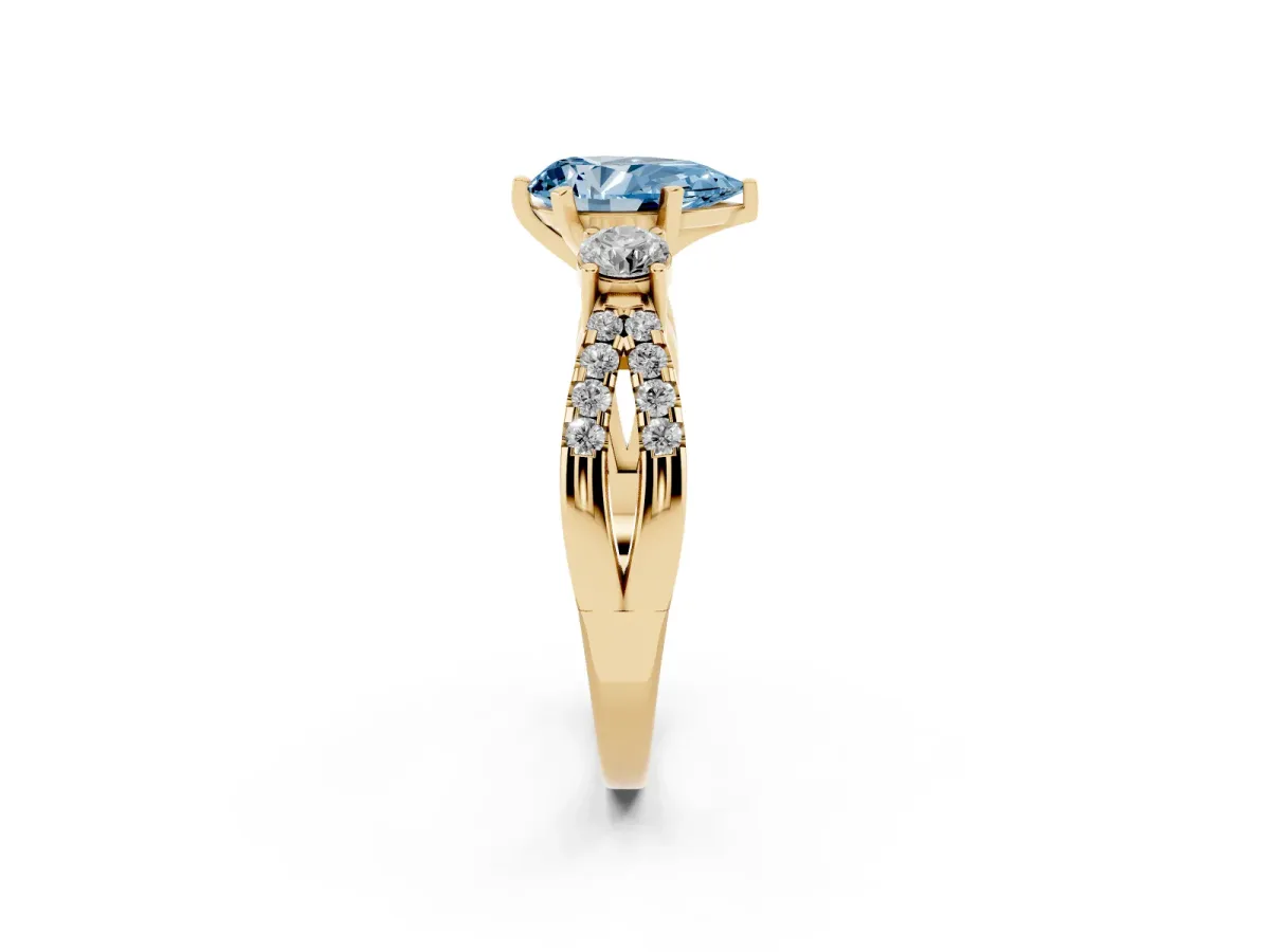 Fancy Blue Pear Cut Diamond Three-Stone Ring with Pavé Split Shank and Four-Prong Setting Yellow gold