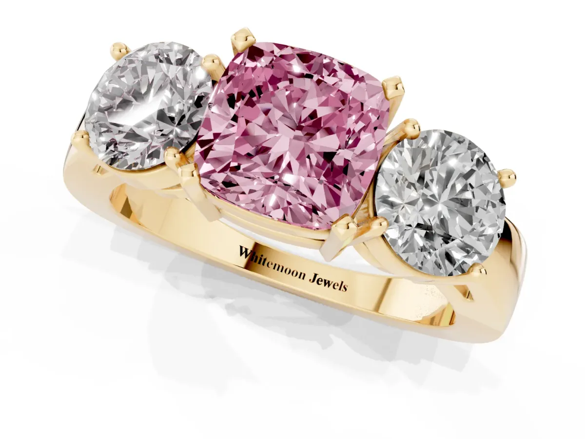Fancy Pink Three-Stone Cushion Cut Diamond Ring with Round Side Stones, Classic Band, and Four-Prong Setting Yellow gold