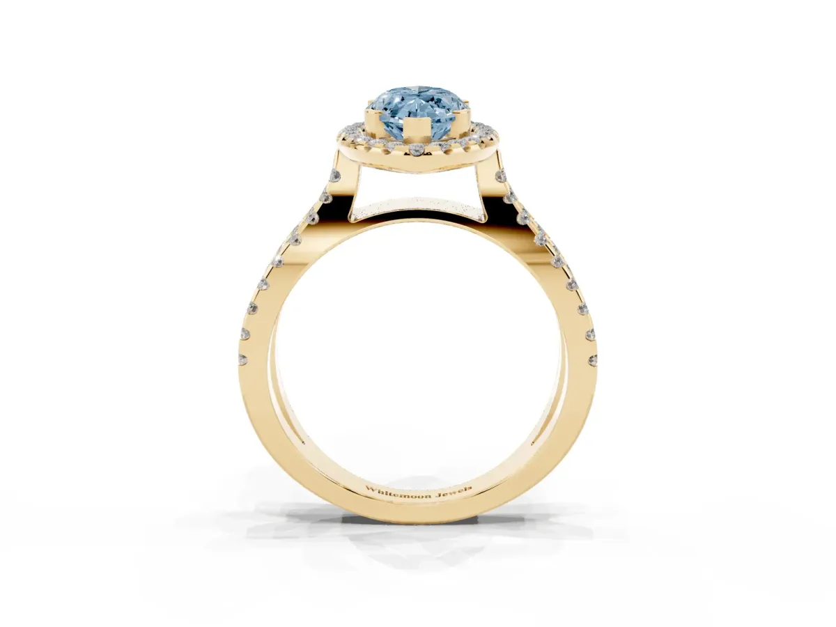 Fancy Blue Marquise Cut Diamond Halo Ring with Split Shank Pavé Band and Prong Setting Yellow gold
