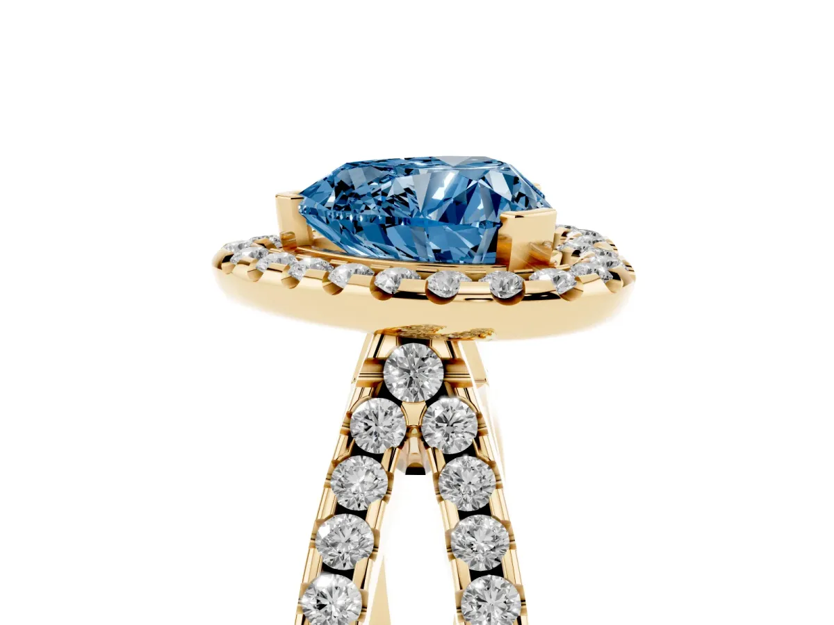 Fancy Blue Heart Cut Diamond Halo Ring with Split Shank Pavé Band and Prong Setting Yellow gold
