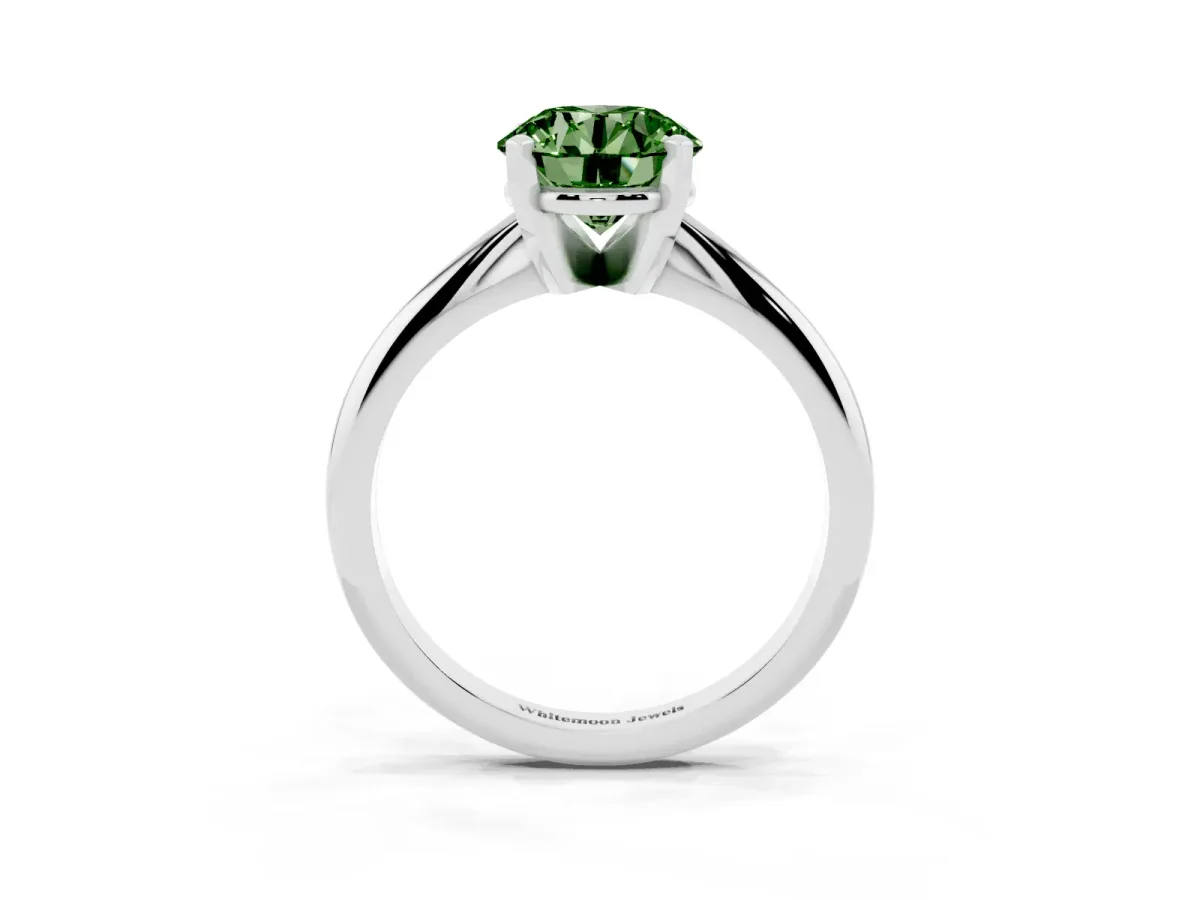 Fancy Green Round Cut Cut Solitaire Ring with Four-Prong Setting on a Classic Band Silver