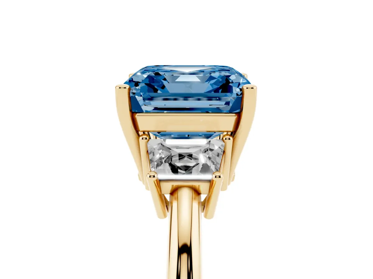 Fancy Blue Asscher Cut Diamond Three-Stone Ring with Trapezoid Side Stones and Prong Setting Yellow gold