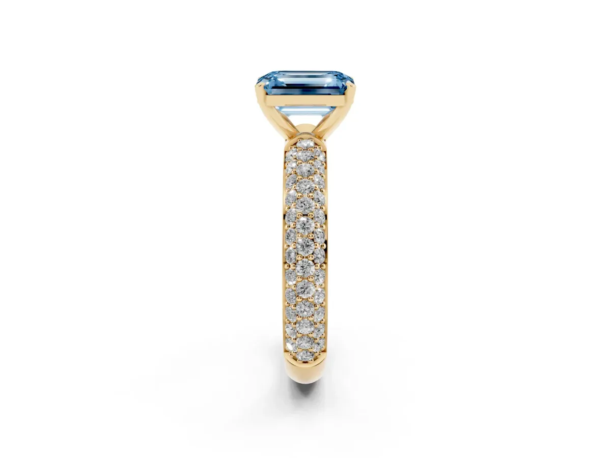 Fancy Blue Emerald Cut Diamond Solitaire Ring with Prong Setting and Pavé Band Yellow gold