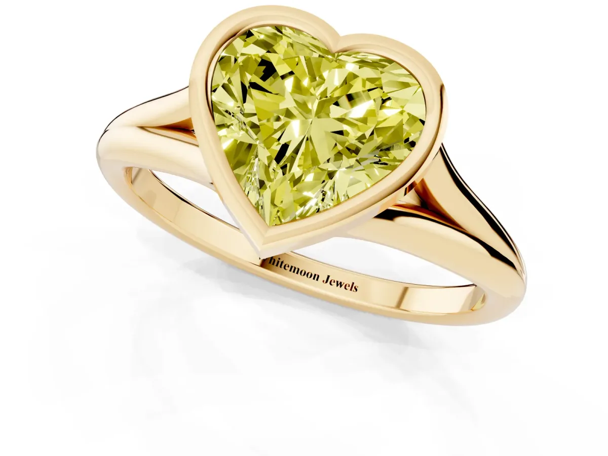 Fancy Yellow Bezel Set Heart Cut Cut Solitaire Ring with Tapered Band Yellow gold