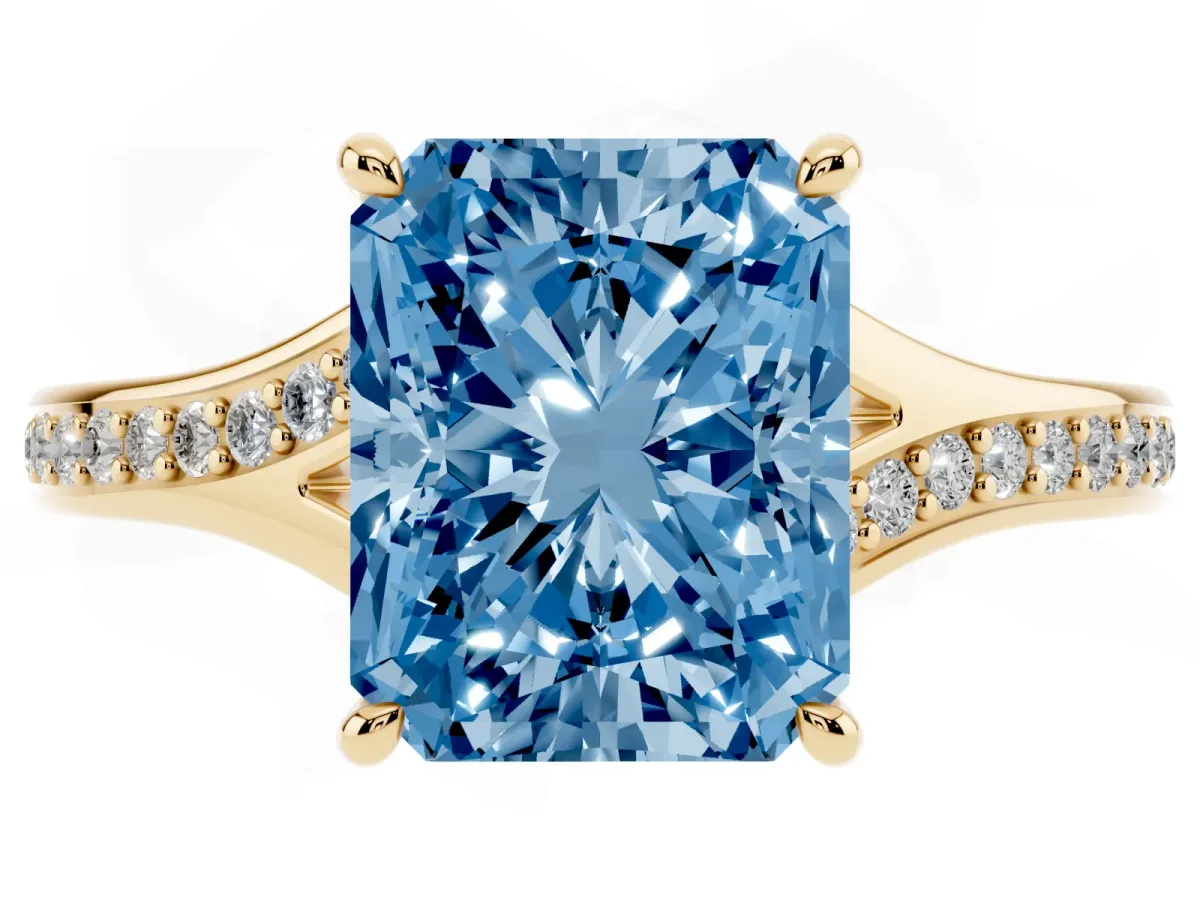 Fancy Blue Radiant Cut Diamond Solitaire Ring with Pavé Band and Prong Setting Yellow gold