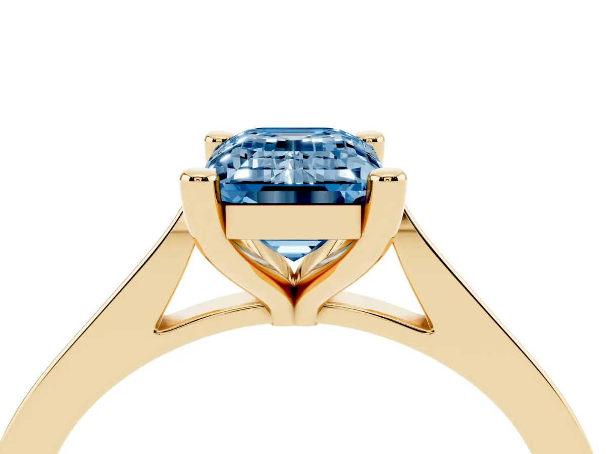 Fancy Blue Emerald Cut Solitaire Diamond Ring with Four-Prong Setting and Tapered Band Yellow gold
