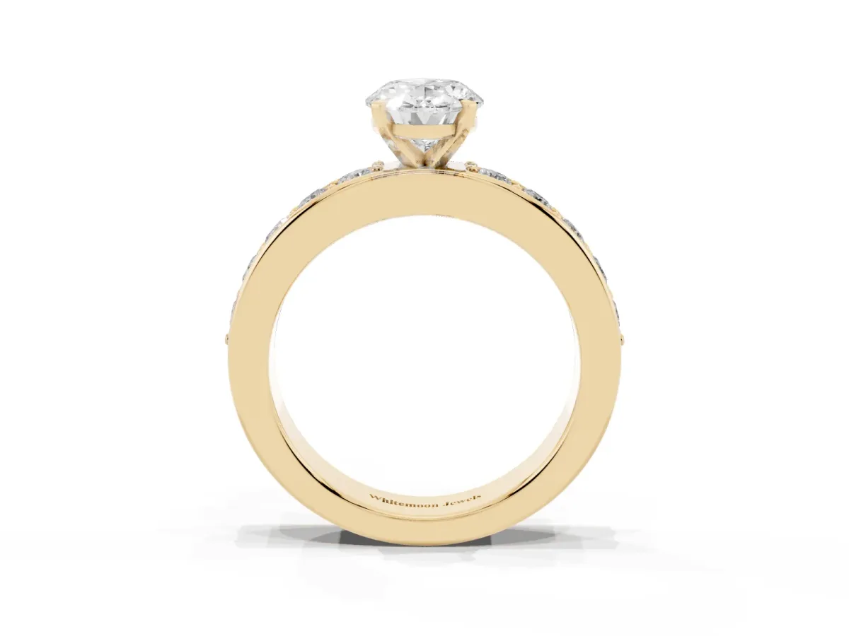 Oval Cut Diamond Engagement Ring with Channel Set Round Band and Prong Setting Yellow gold